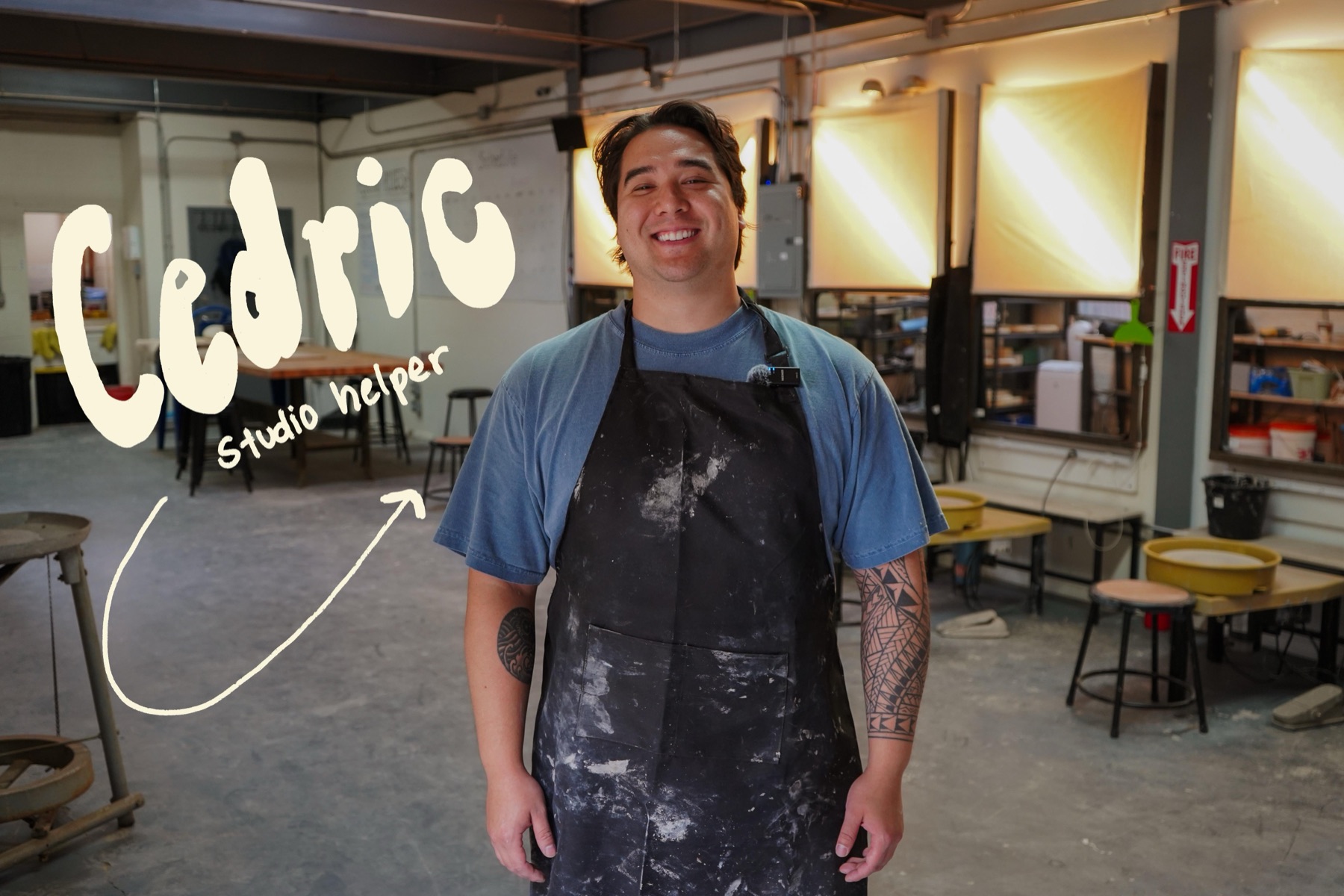 Cedric, a Claymore studio helper, on the studio floor in a clay-splattered apron