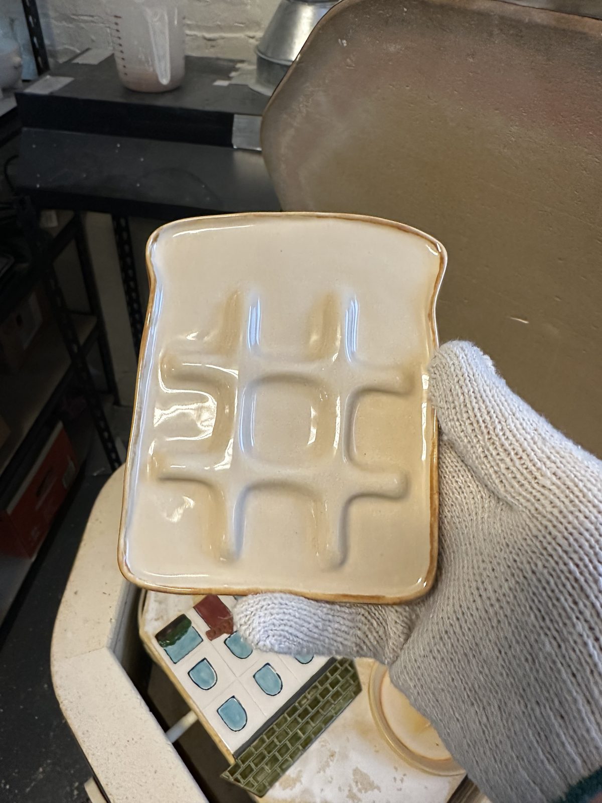 A whimsical toast-shaped ceramic tray